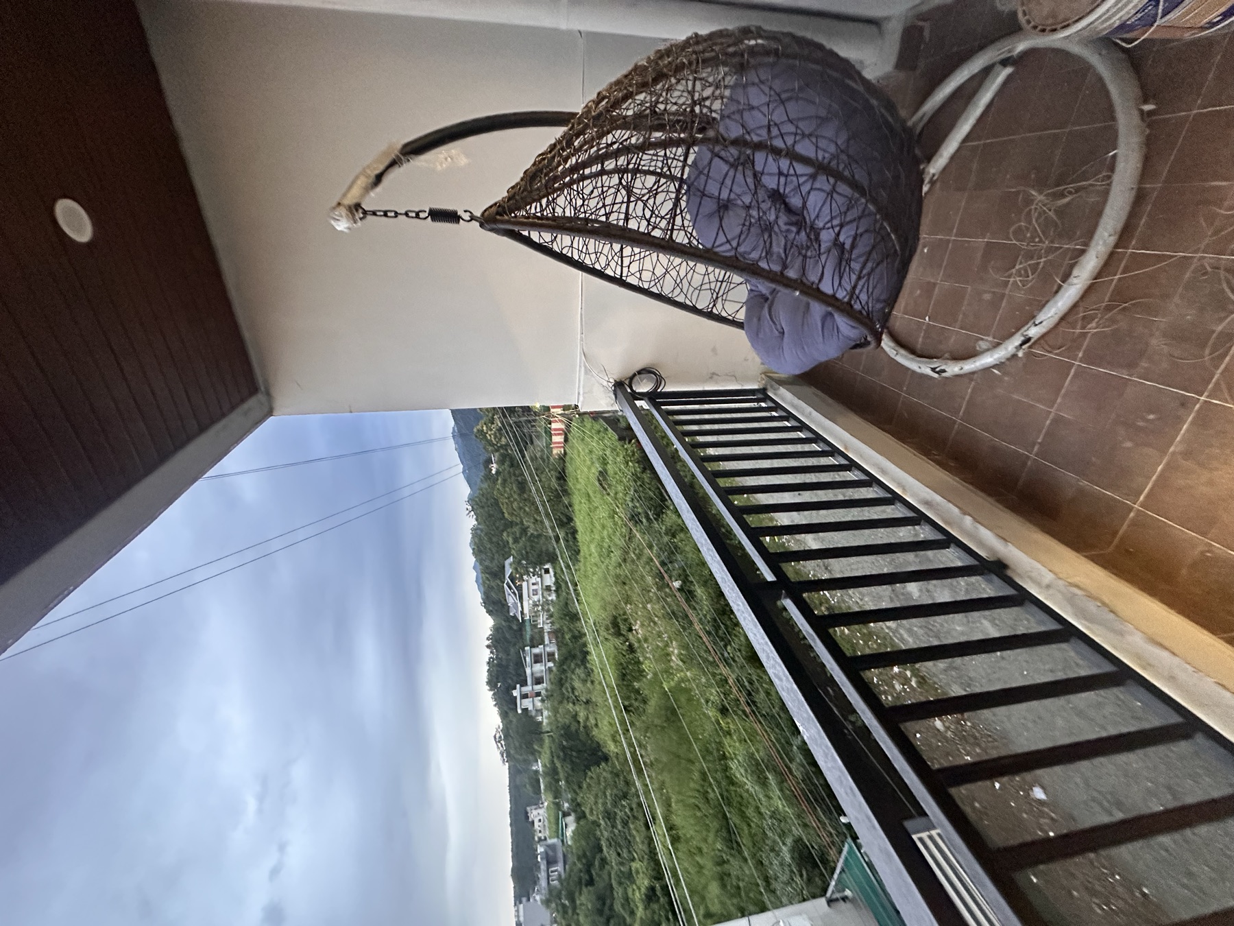 The Ivory House · balcony swing and green outlook