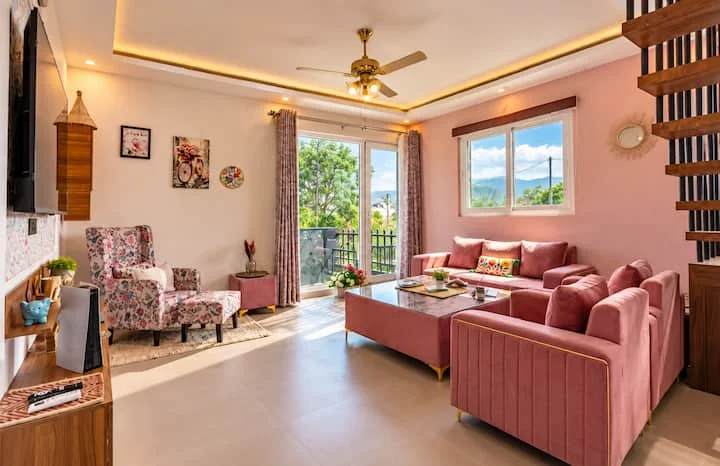 Musk Rose · Sunlit living room and balcony doors